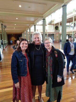 Satellite participant Denna Healey with Royal Commission into Mental Health's Penny Armitage and Satellite CEO Rose Cuff. The are smiling at the camera. 